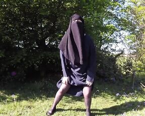 Muslim in burqa and stockings – flashing outdoors