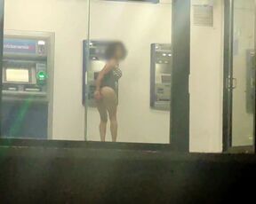 Sissy in slutty dress masturbating her ass in public ATM with dildo at night