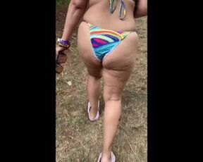 Wife in bikini walking up hill